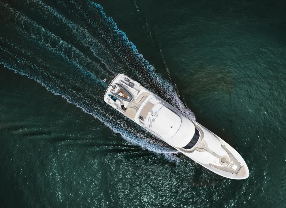 Yacht cruising along a Hawaiian coastline